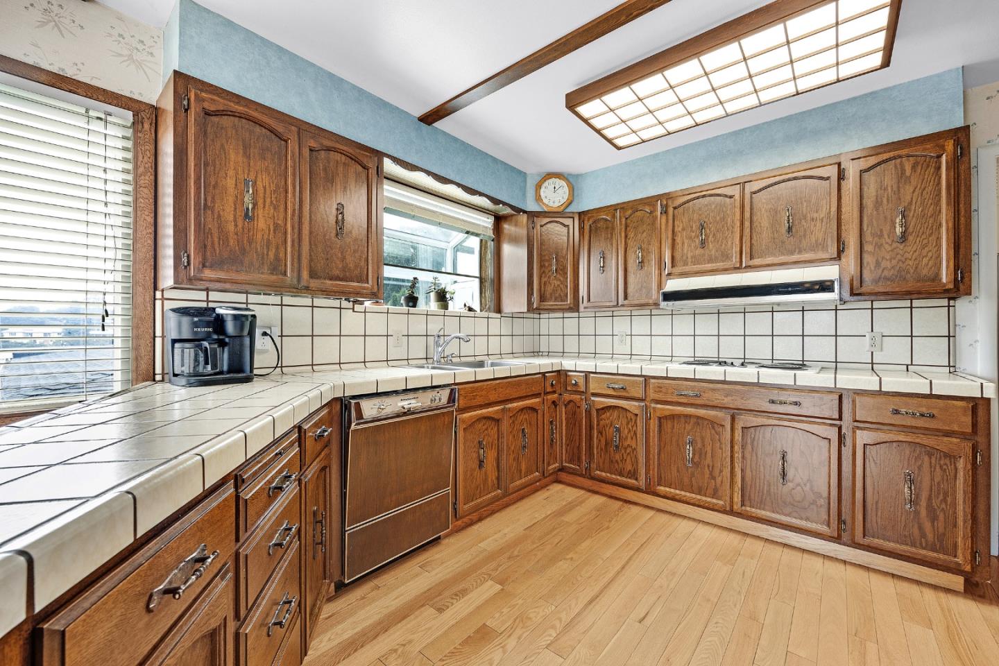 6 Fairview Place Millbrae, CA 94030 - Photo 9 of 19 a kitchen with stainless steel appliances granite countertop wooden cabinets a sink and dishwasher