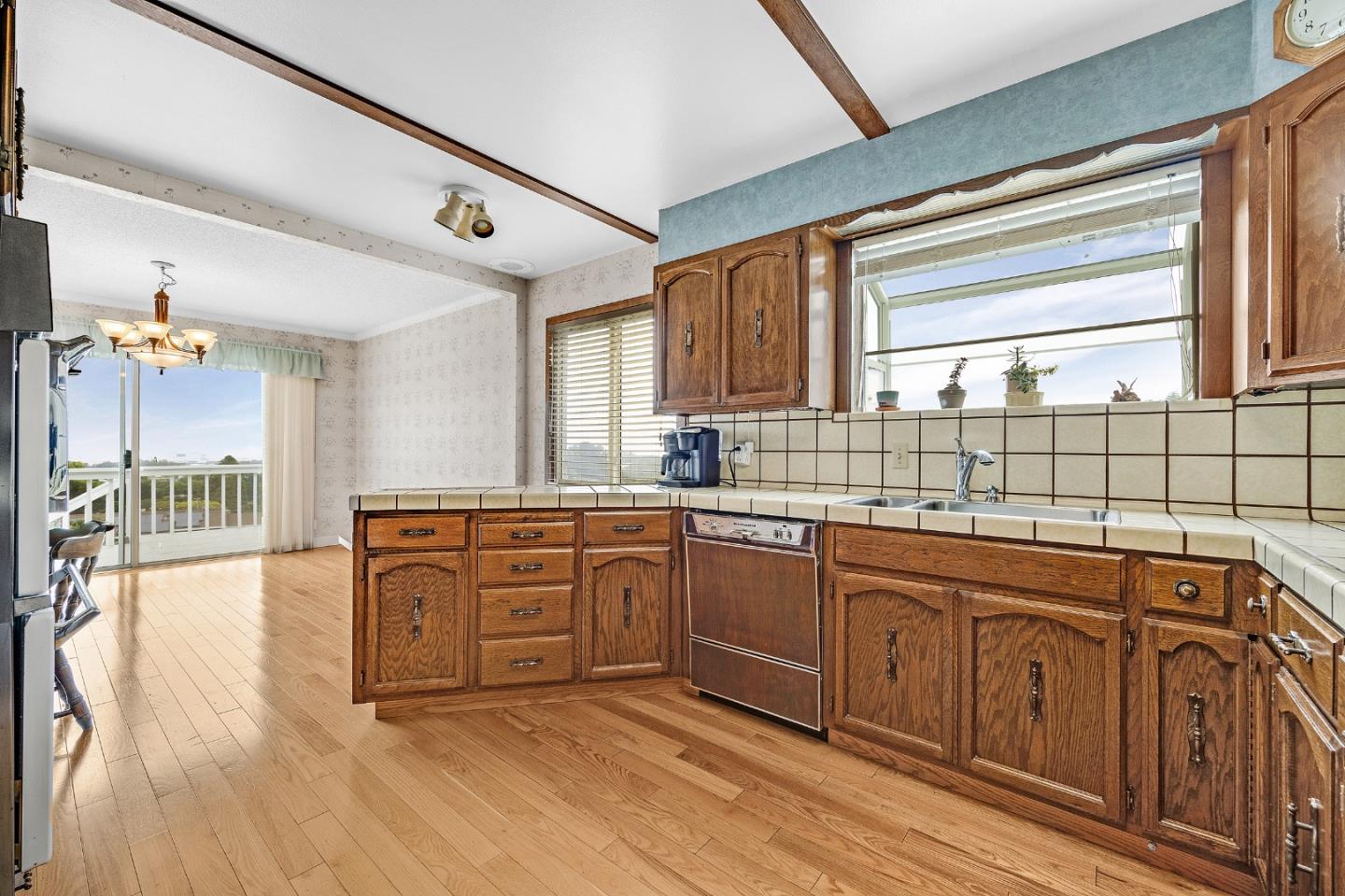 6 Fairview Place Millbrae, CA 94030 - Photo 10 of 19 a kitchen with stainless steel appliances granite countertop a sink and cabinets