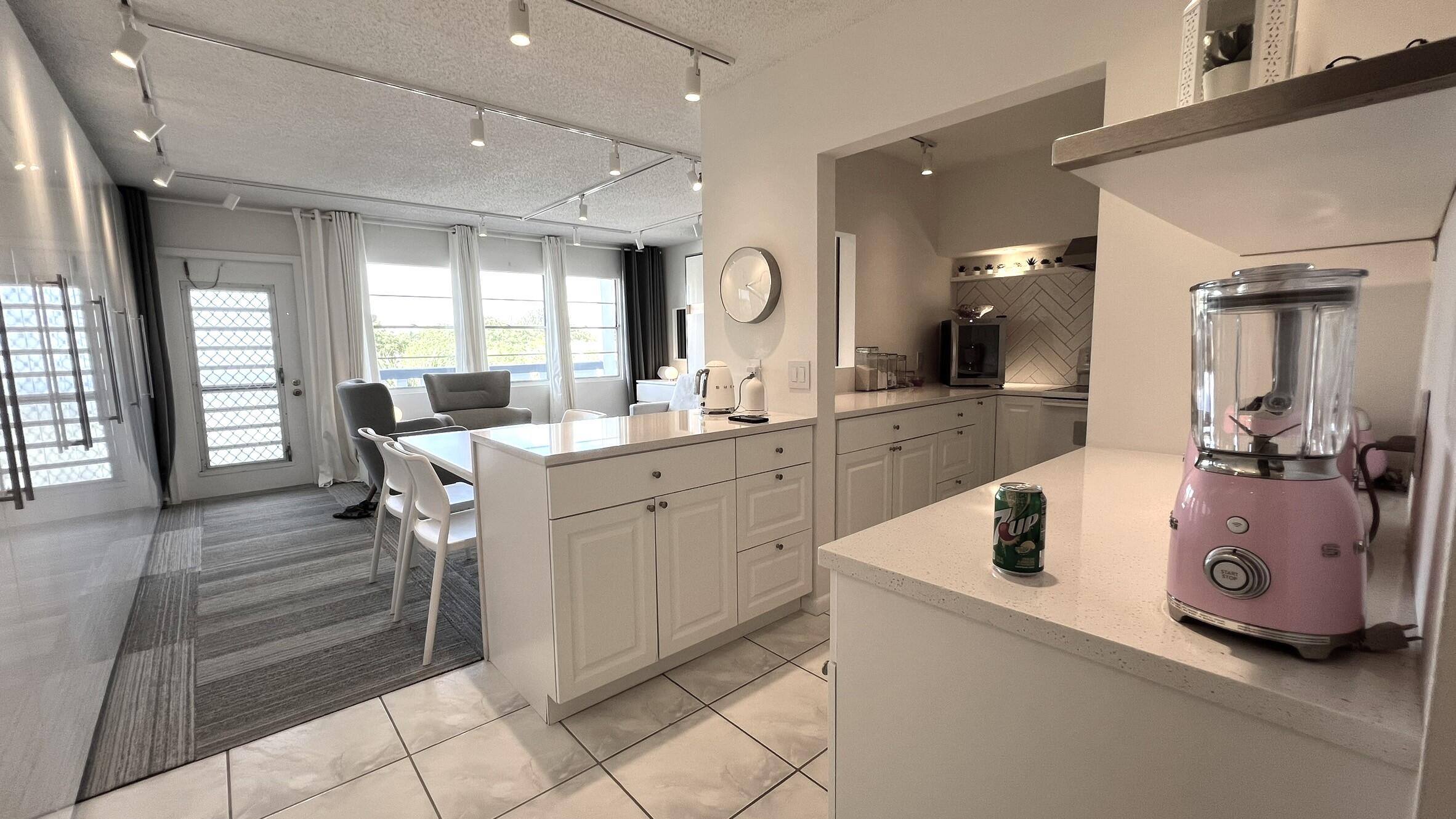 3027 Durham B Deerfield Beach, FL 33442 - Photo 11 of 25 a room with sink washer and dryer