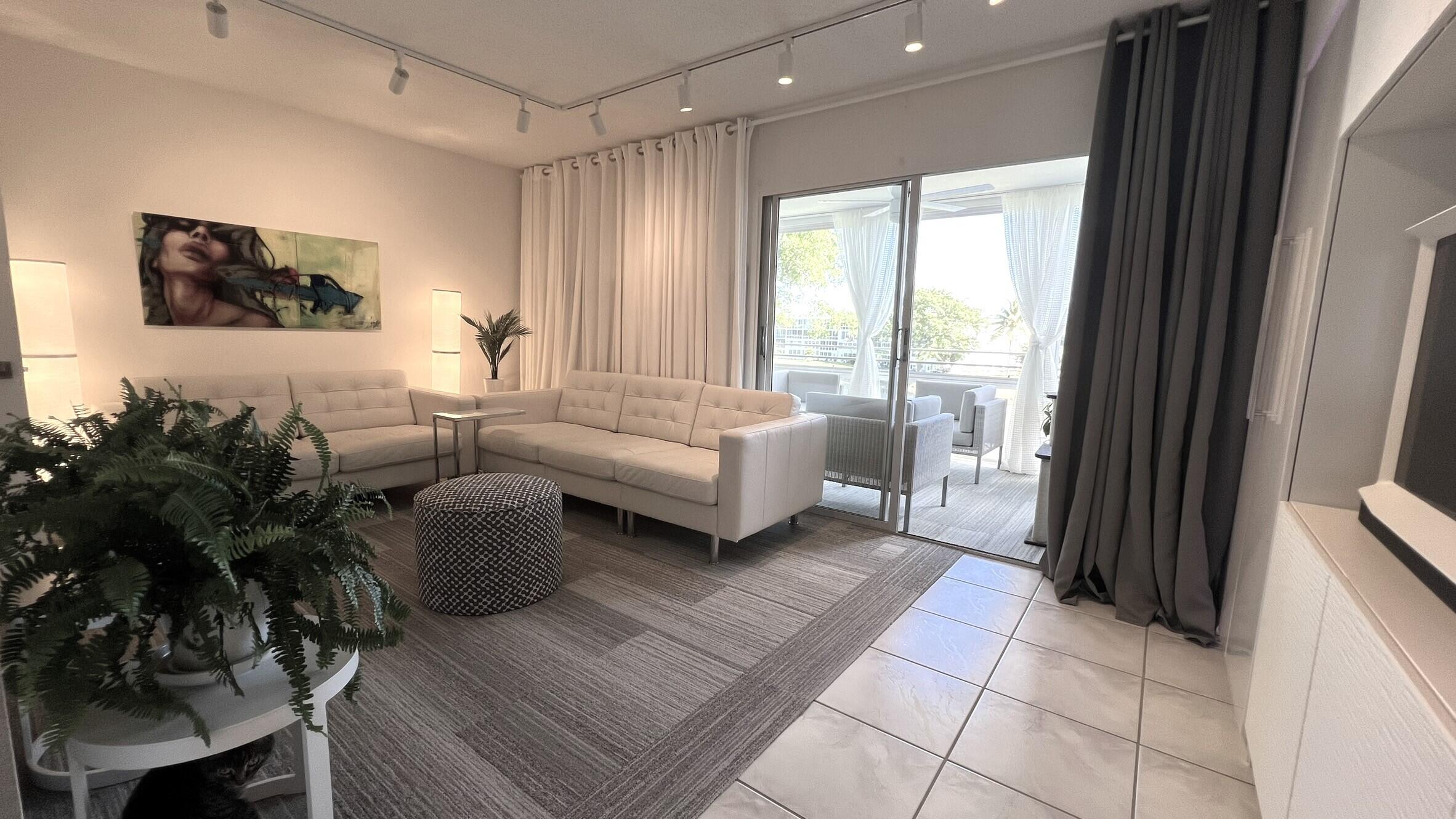 3027 Durham B Deerfield Beach, FL 33442 - Photo 17 of 25 a living room with furniture and a large window