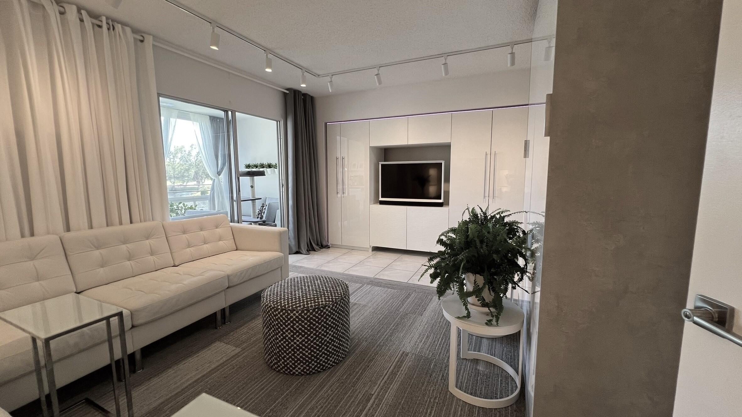 3027 Durham B Deerfield Beach, FL 33442 - Photo 18 of 25 a living room with furniture and a flat screen tv