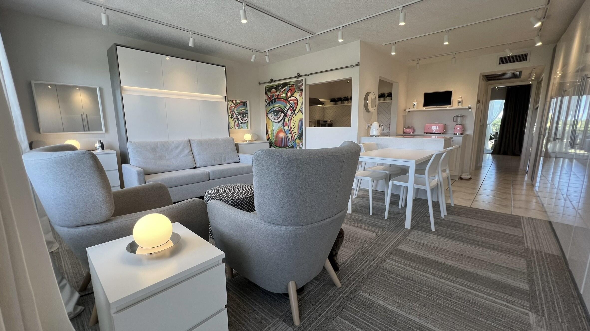 3027 Durham B Deerfield Beach, FL 33442 - Photo 2 of 25 a living room with furniture and a table