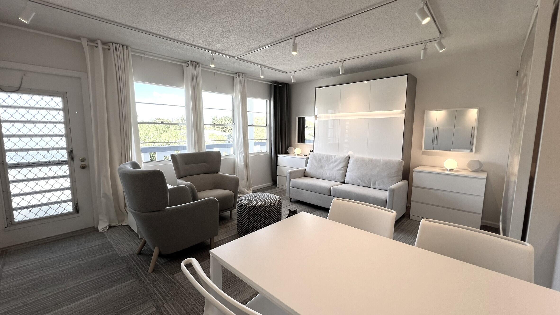 3027 Durham B Deerfield Beach, FL 33442 - Photo 5 of 25 a living room with furniture and a window