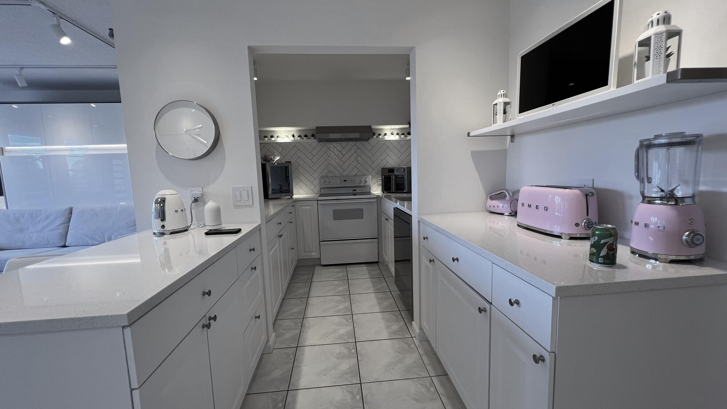 3027 Durham B Deerfield Beach, FL 33442 - Photo 9 of 25 a kitchen with cabinets and sink