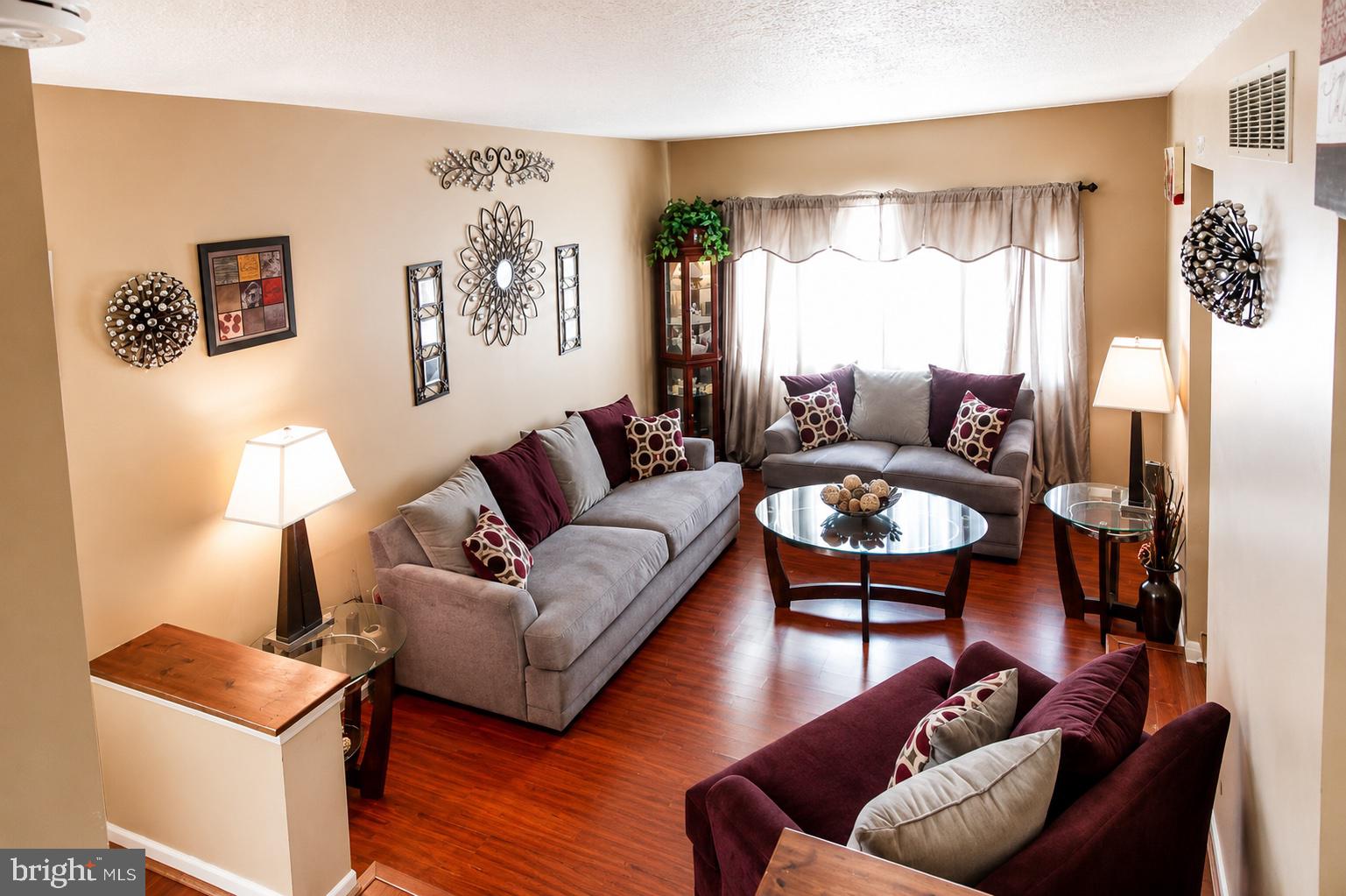 8121 Elizabeth Road Pasadena, MD 21122 - Photo 7 of 27 a living room with furniture and a large window