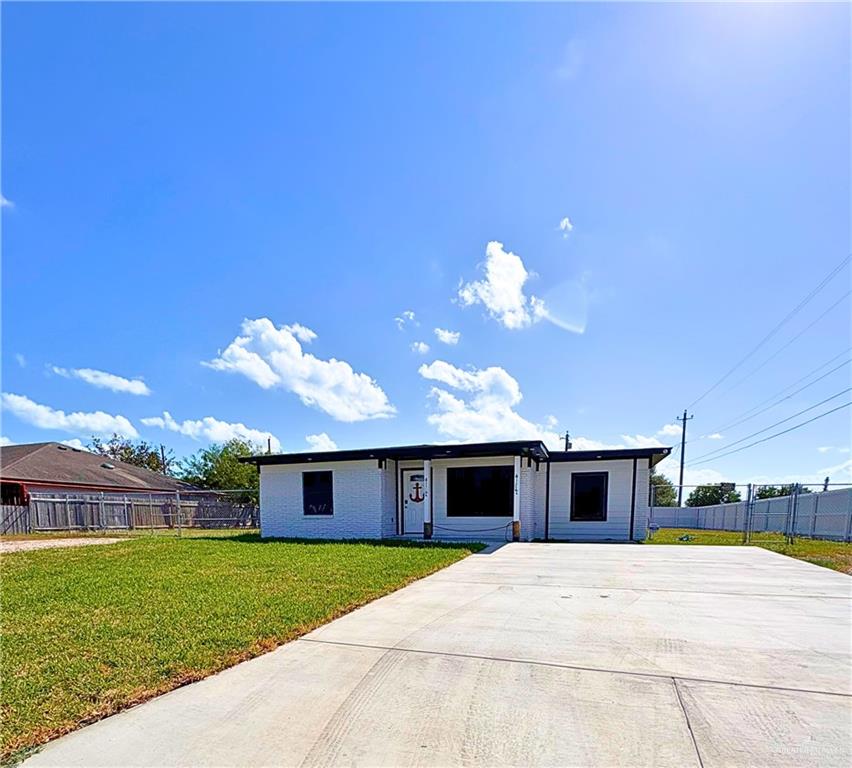 1651 Michigan Avenue Port Isabel, TX 78578 - Photo 2 of 17 a view of a house with a backyard and a garden