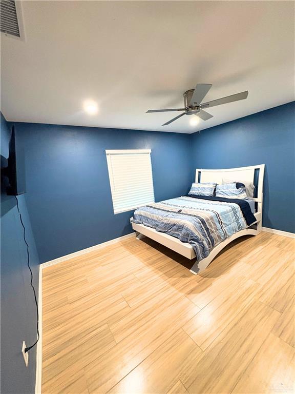 1651 Michigan Avenue Port Isabel, TX 78578 - Photo 9 of 17 a bedroom with a bed and a night stand