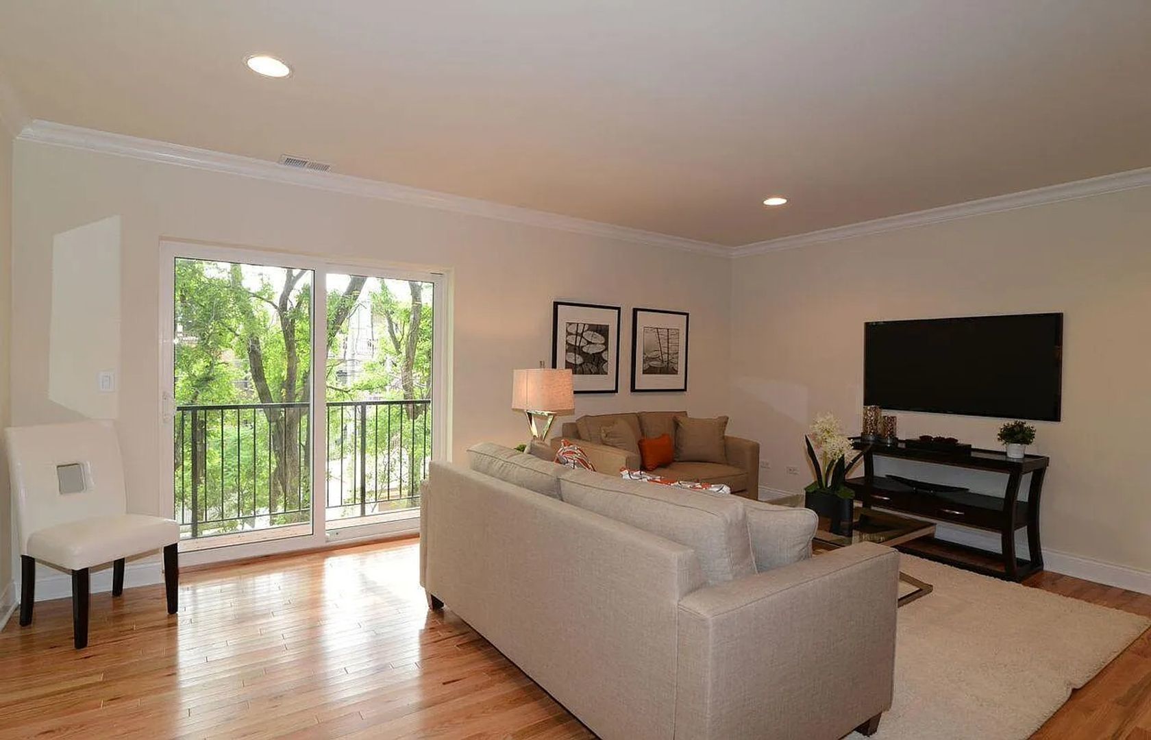 4520 North Beacon Street, Unit 401 Chicago, IL 60640 - Photo 3 of 11 a living room with furniture and a flat screen tv