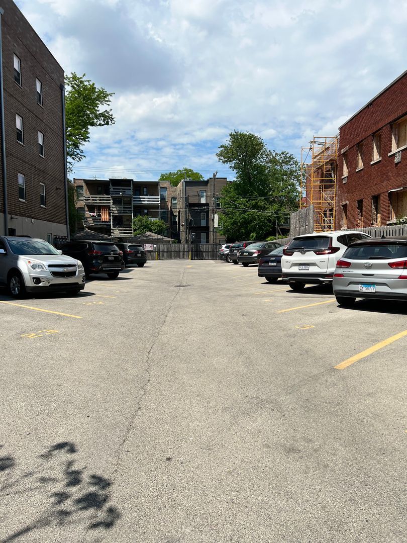 4520 North Beacon Street, Unit 401 Chicago, IL 60640 - Photo 10 of 11 a view of street with parked cars