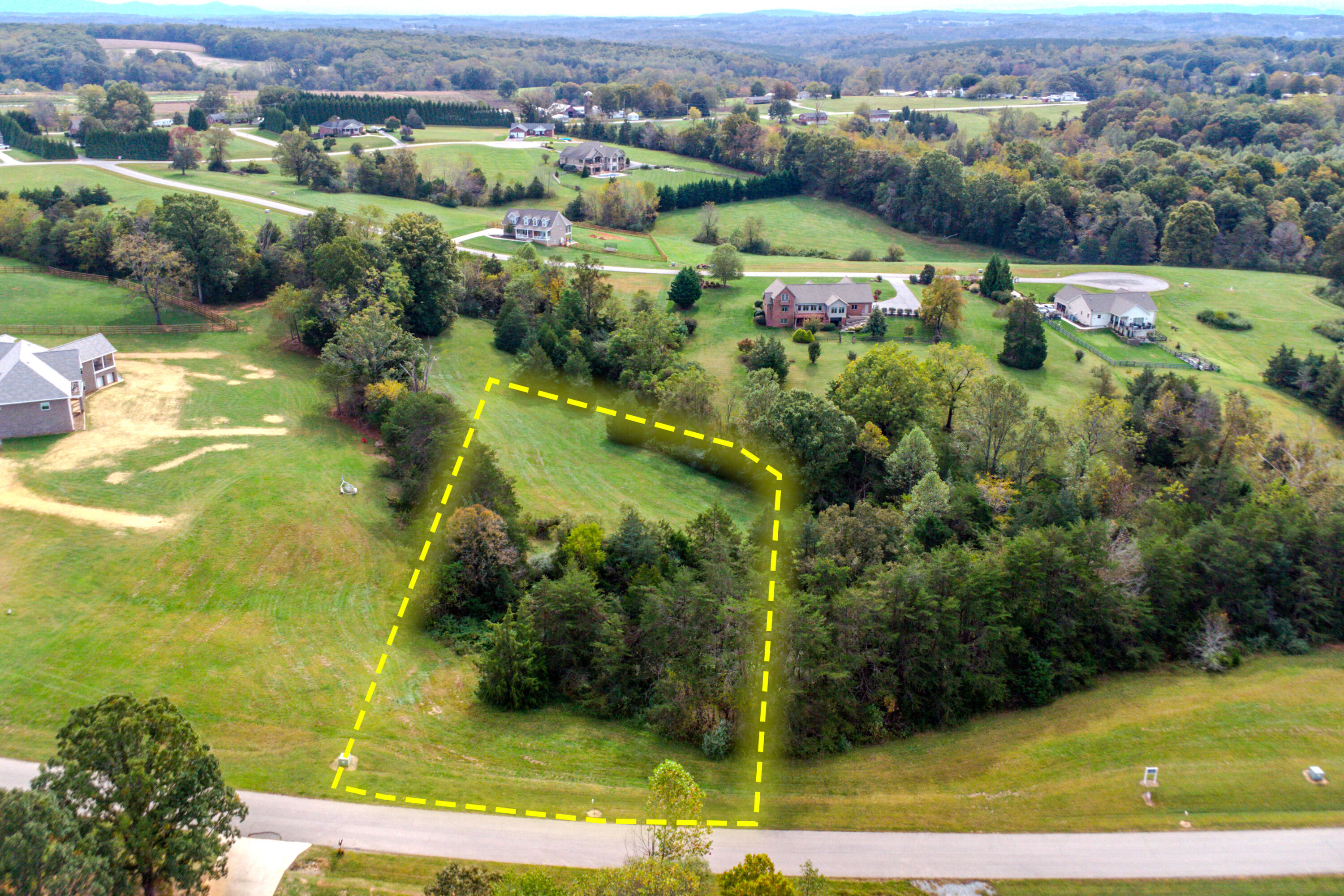 Lot 26 Nyle Ridge Road Wirtz, VA 24184 - Photo 1 of 8 an aerial view of residential houses with outdoor space and swimming pool