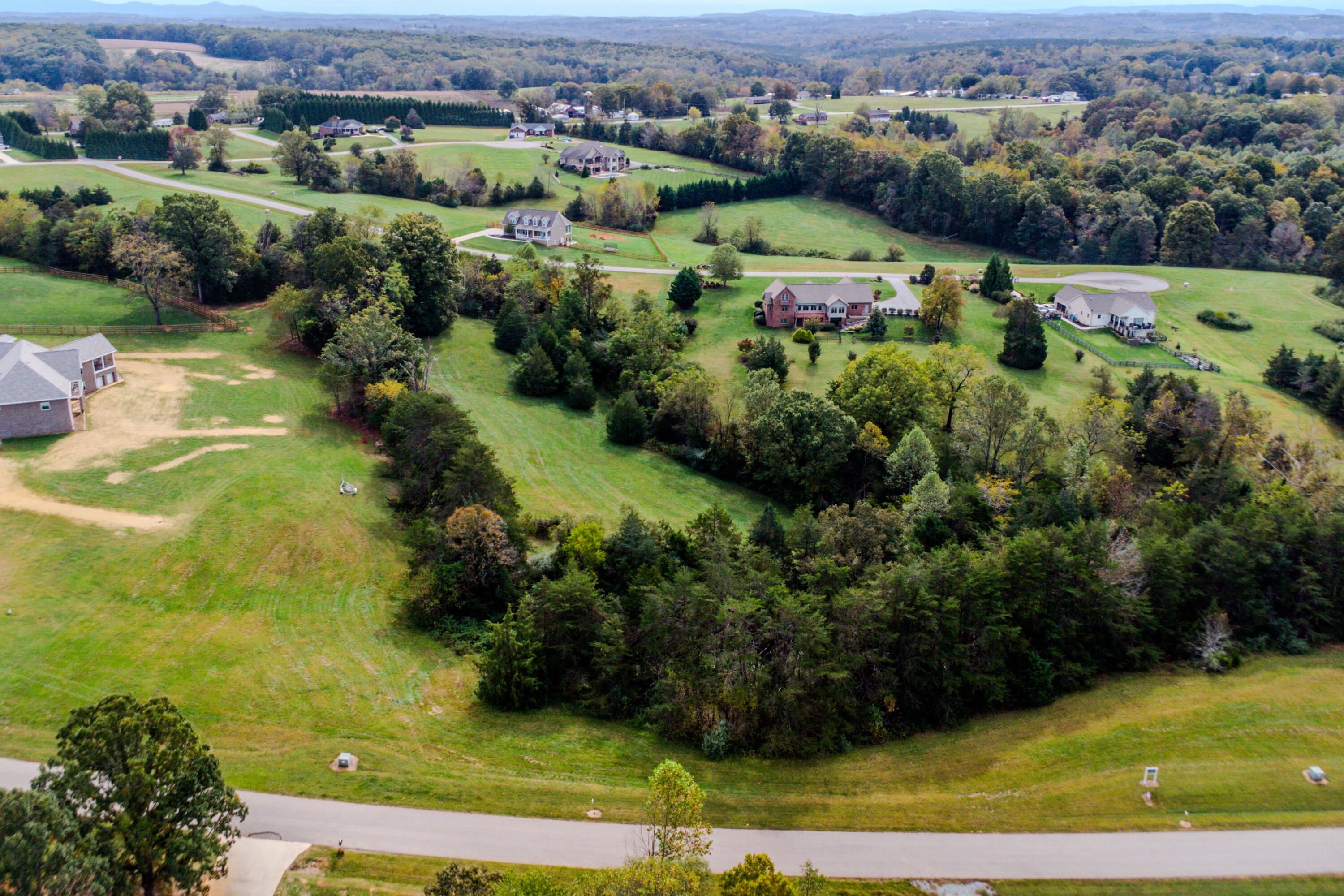 Lot 26 Nyle Ridge Road Wirtz, VA 24184 - Photo 2 of 8 an aerial view of residential houses with outdoor space and trees