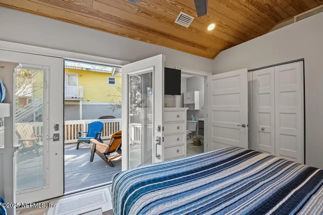 a view of a house with a tree in front