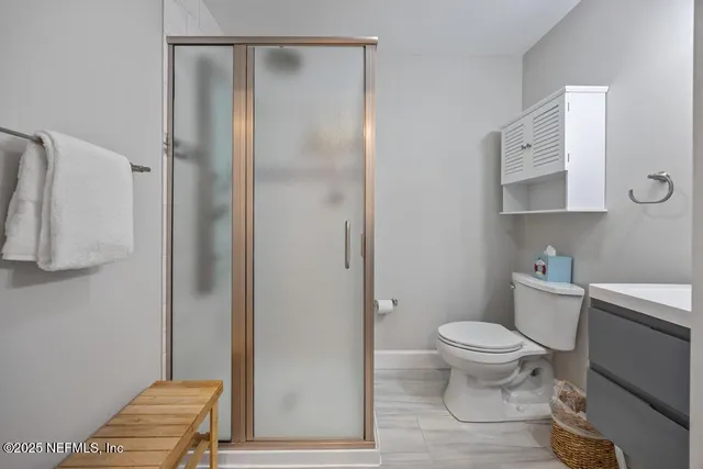 an aerial view of residential building with lake view in back