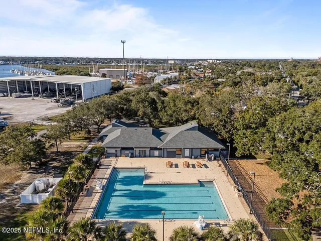 a kitchen with stainless steel appliances white cabinets and a window