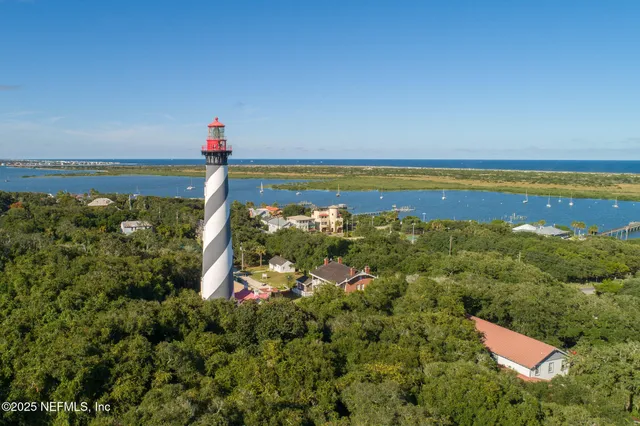 an aerial view of residential building and ocean