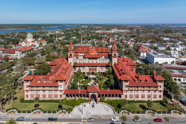 a kitchen with kitchen island granite countertop a sink stainless steel appliances and cabinets
