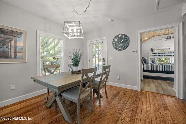 a kitchen with stainless steel appliances granite countertop a refrigerator a stove and a sink