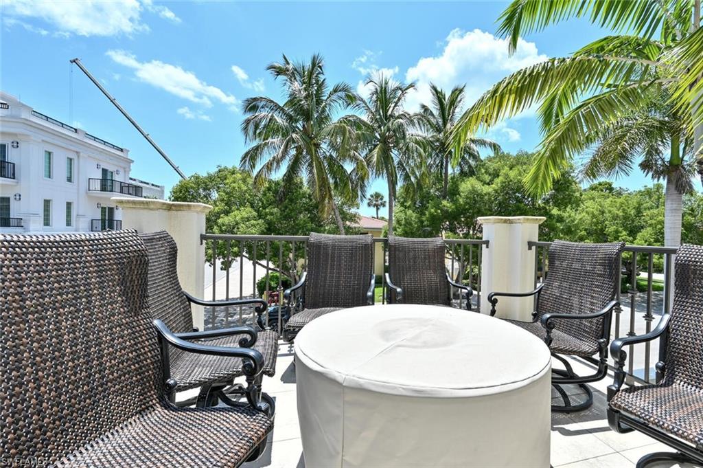433 5th Street South Naples, FL 34102 - Photo 22 of 39 a view of a chairs and table in patio