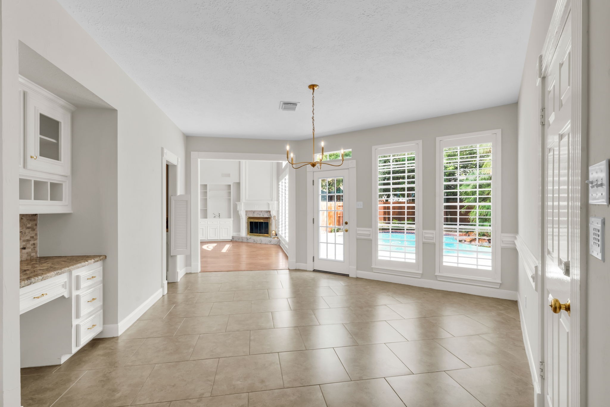 17302 Chagall Lane Spring, TX 77379 - Photo 15 of 44 Start your mornings in this bright breakfast room, with tranquil pool views