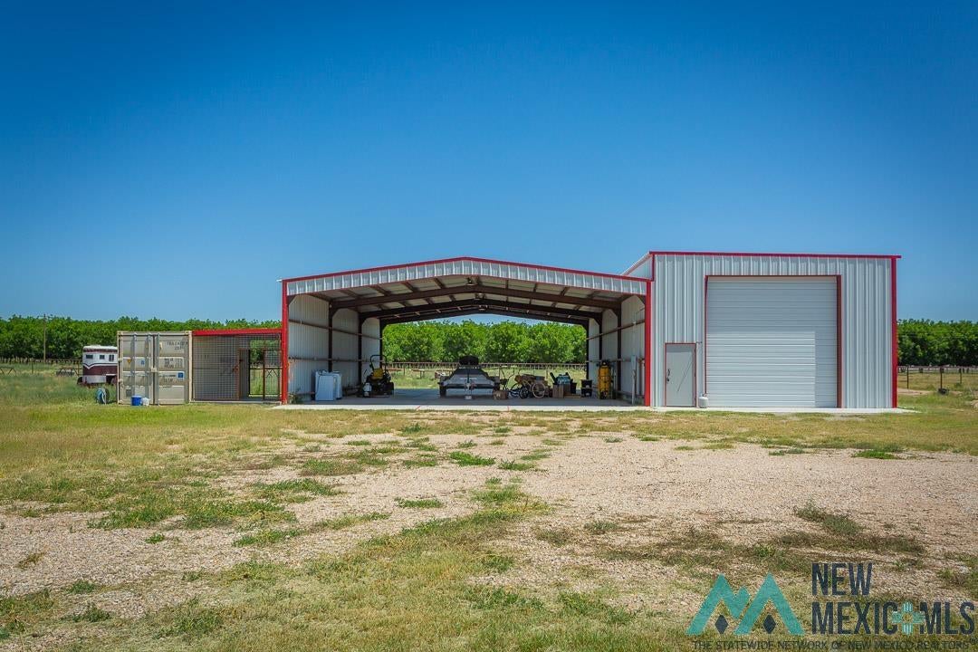 2012 South Haldeman Road Artesia, NM 88210 - Photo 76 of 96 Metal building with an open-sided bay and a fully enclosed bay. RV Building.
