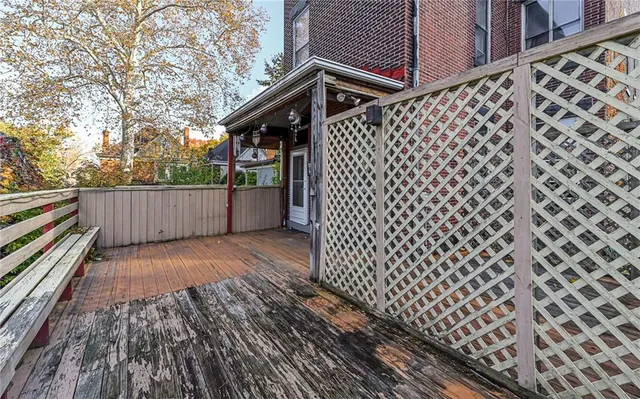 a view of a house with a door and wooden floor
