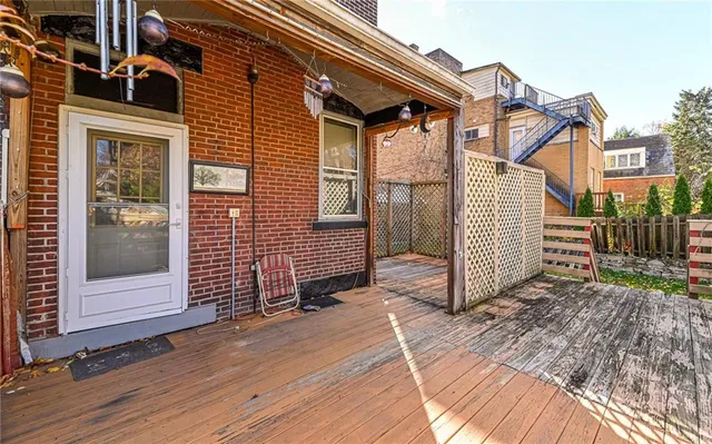a view of a balcony with wooden floor