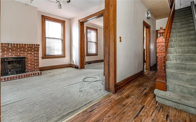a view of livingroom with hardwood floor and front door