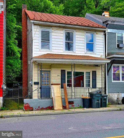 a view of a brick house with a glass door