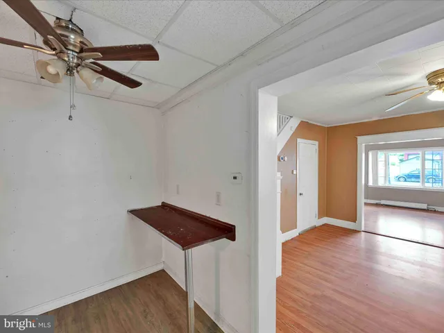 a kitchen with granite countertop a sink cabinets and stainless steel appliances