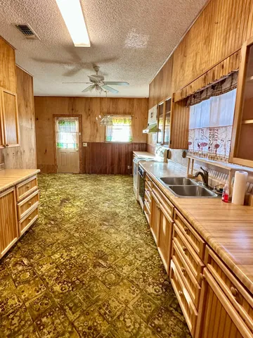 a kitchen with stainless steel appliances a stove and a refrigerator