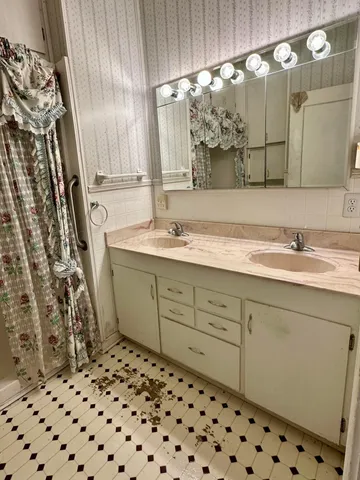 a bathroom with a toilet and a shower curtain