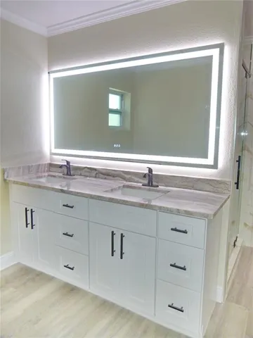a bathroom with a sink and a mirror