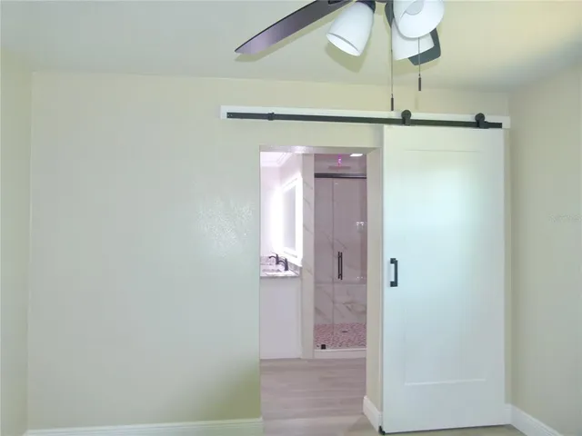 a bathroom with a shower and a mirror