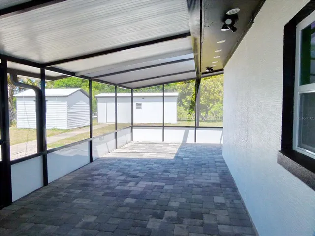 a view of a lake with a house in the background