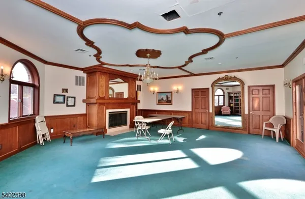 a living room with furniture fireplace and flat screen tv