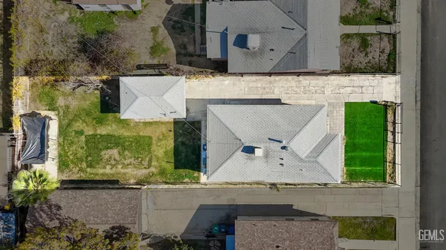 an aerial view of a house with a swimming pool
