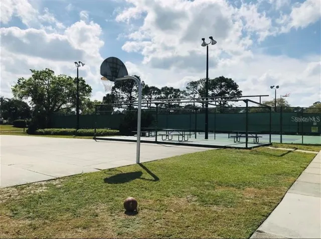 a swimming pool view with a garden