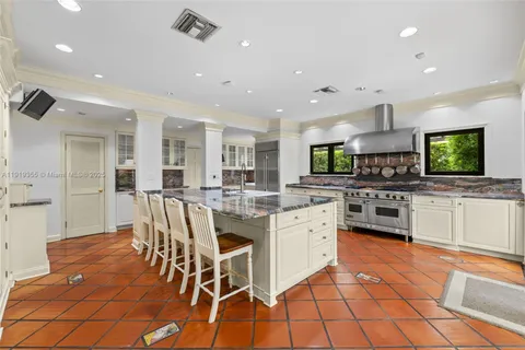 a kitchen with a stove and a sink