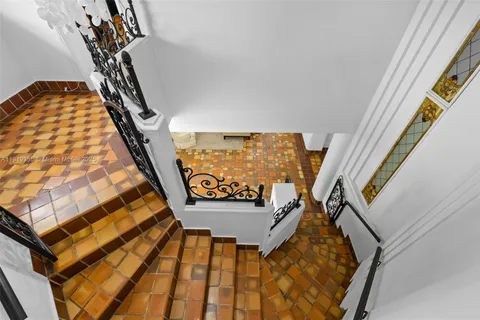 a bedroom with a bed furniture and wooden floor
