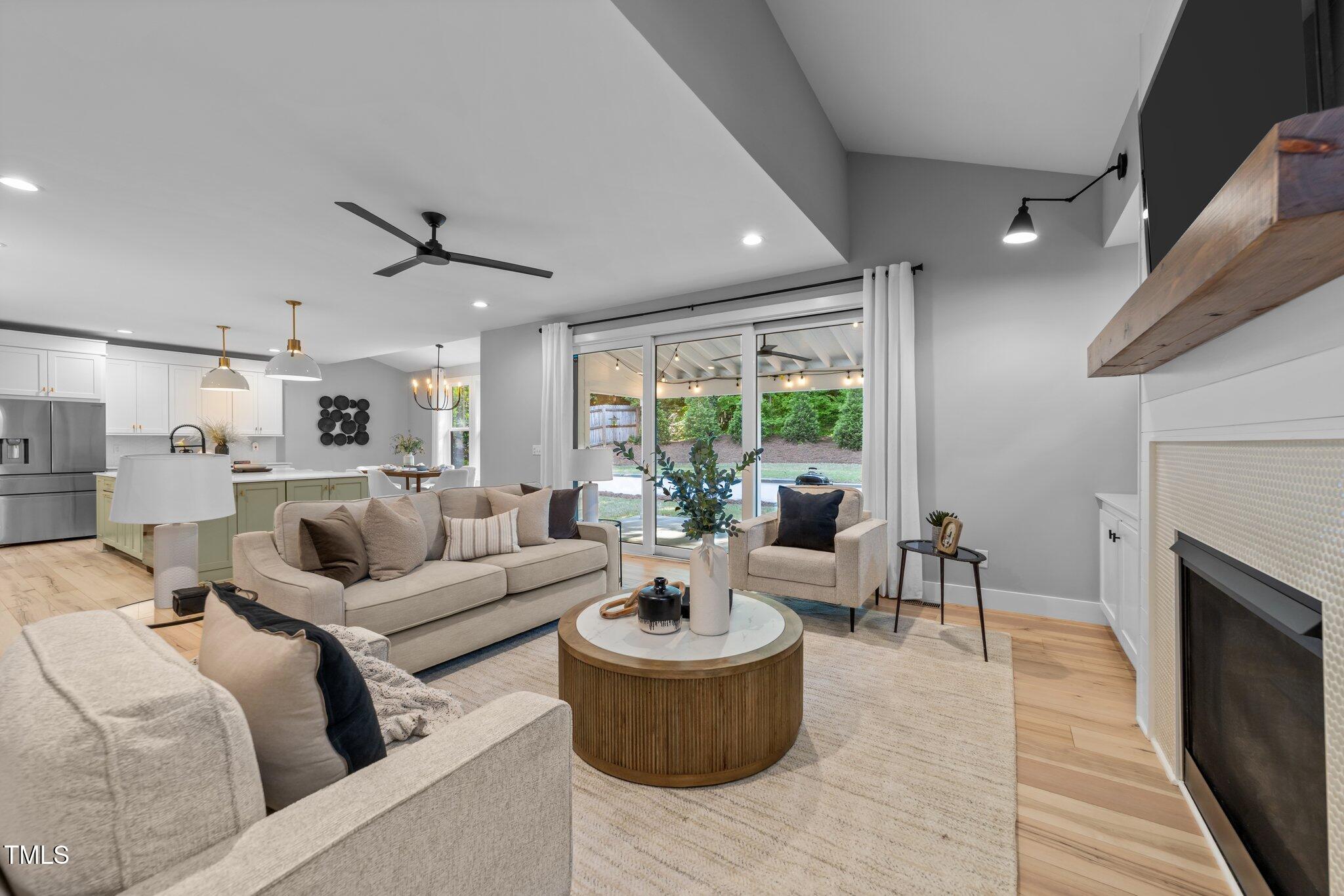 3316 Milton Road Raleigh, NC 27609 - Photo 11 of 50 a living room with furniture and a fireplace