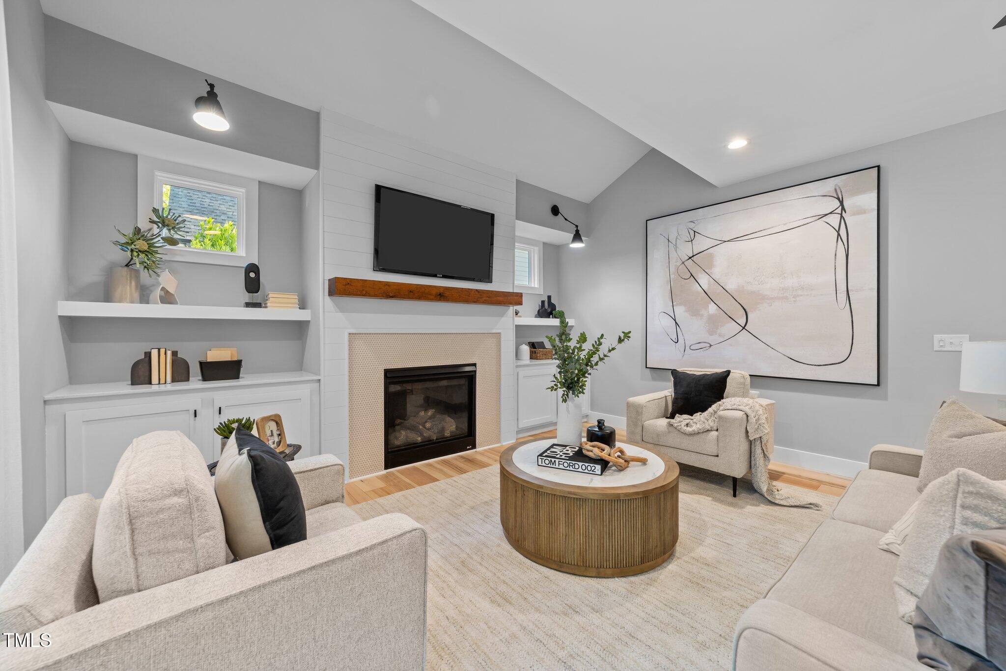 3316 Milton Road Raleigh, NC 27609 - Photo 12 of 50 a living room with furniture and a fireplace