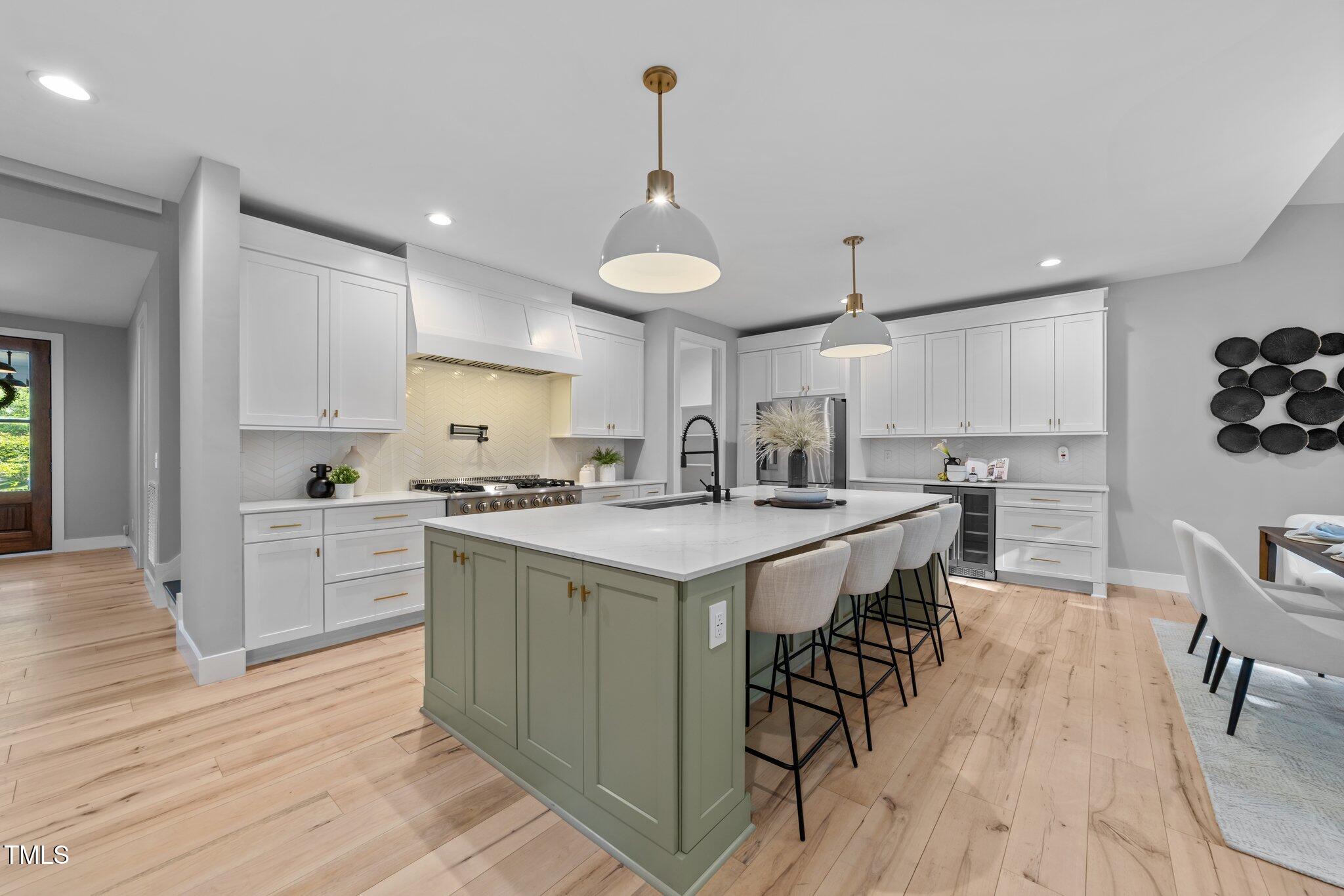 3316 Milton Road Raleigh, NC 27609 - Photo 14 of 50 a kitchen with a sink a counter top space and stainless steel appliances