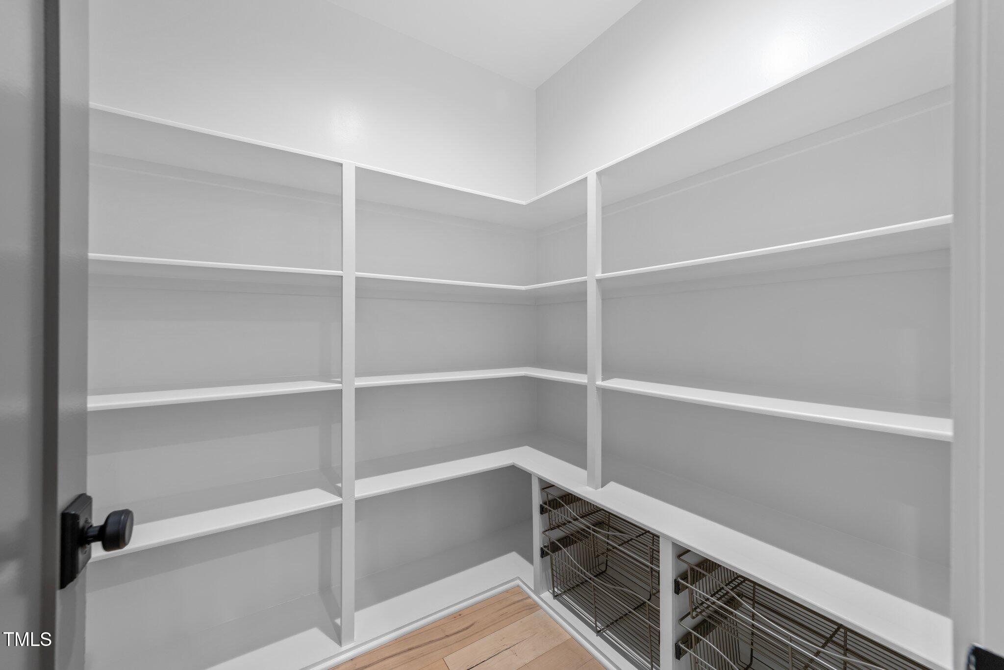 3316 Milton Road Raleigh, NC 27609 - Photo 16 of 50 a view of walk in closet with empty racks