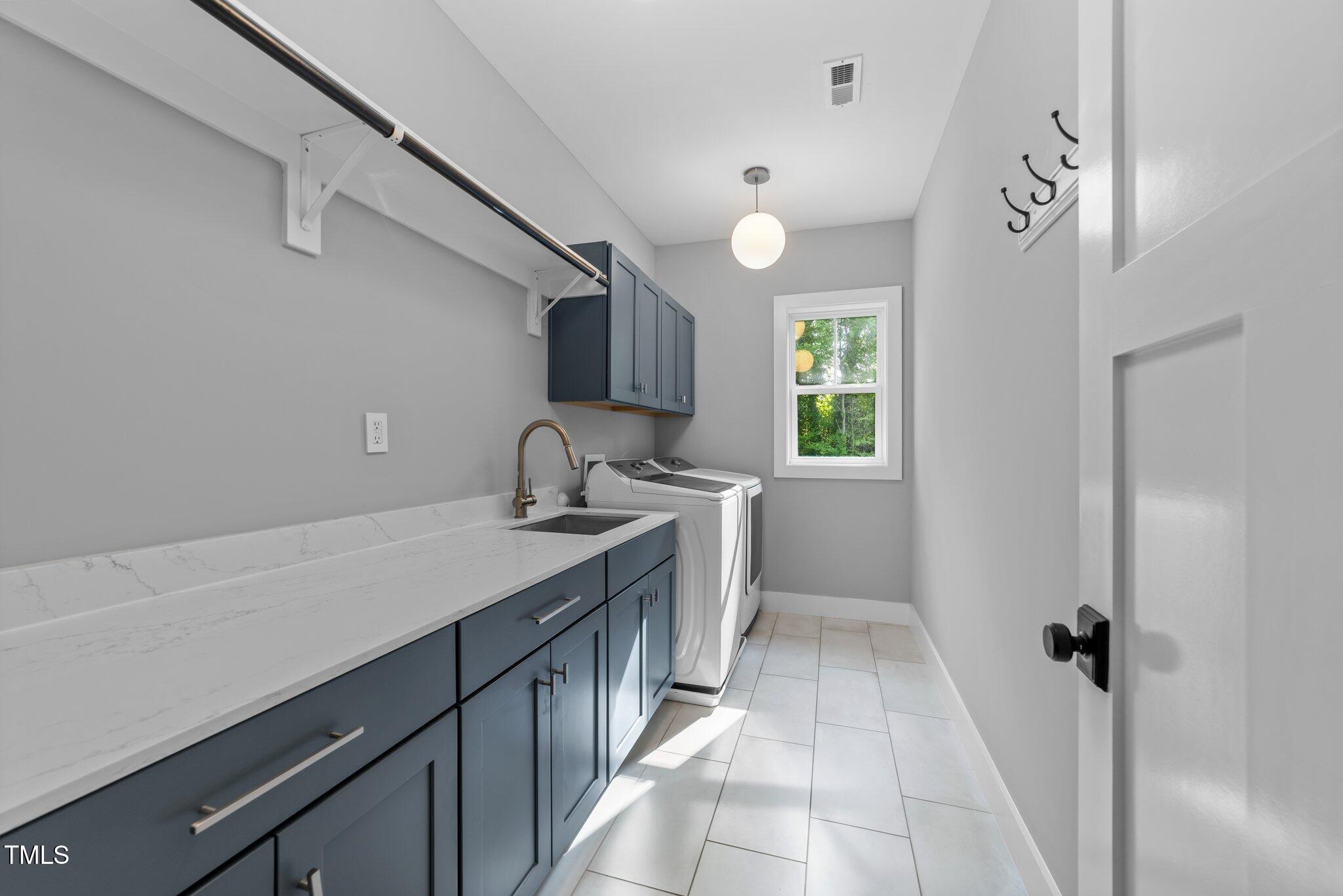 3316 Milton Road Raleigh, NC 27609 - Photo 21 of 50 a kitchen with a sink and cabinets