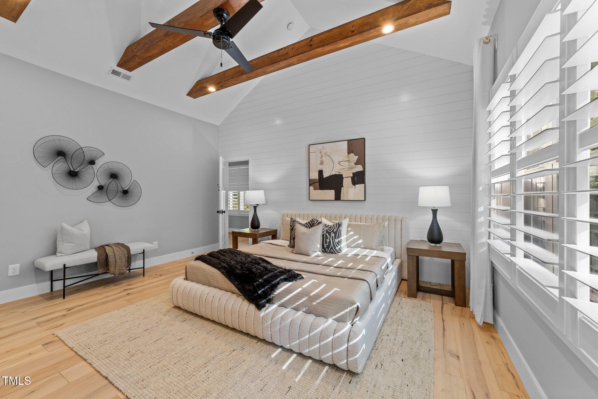 3316 Milton Road Raleigh, NC 27609 - Photo 25 of 50 a spacious bedroom with a bed and a large window
