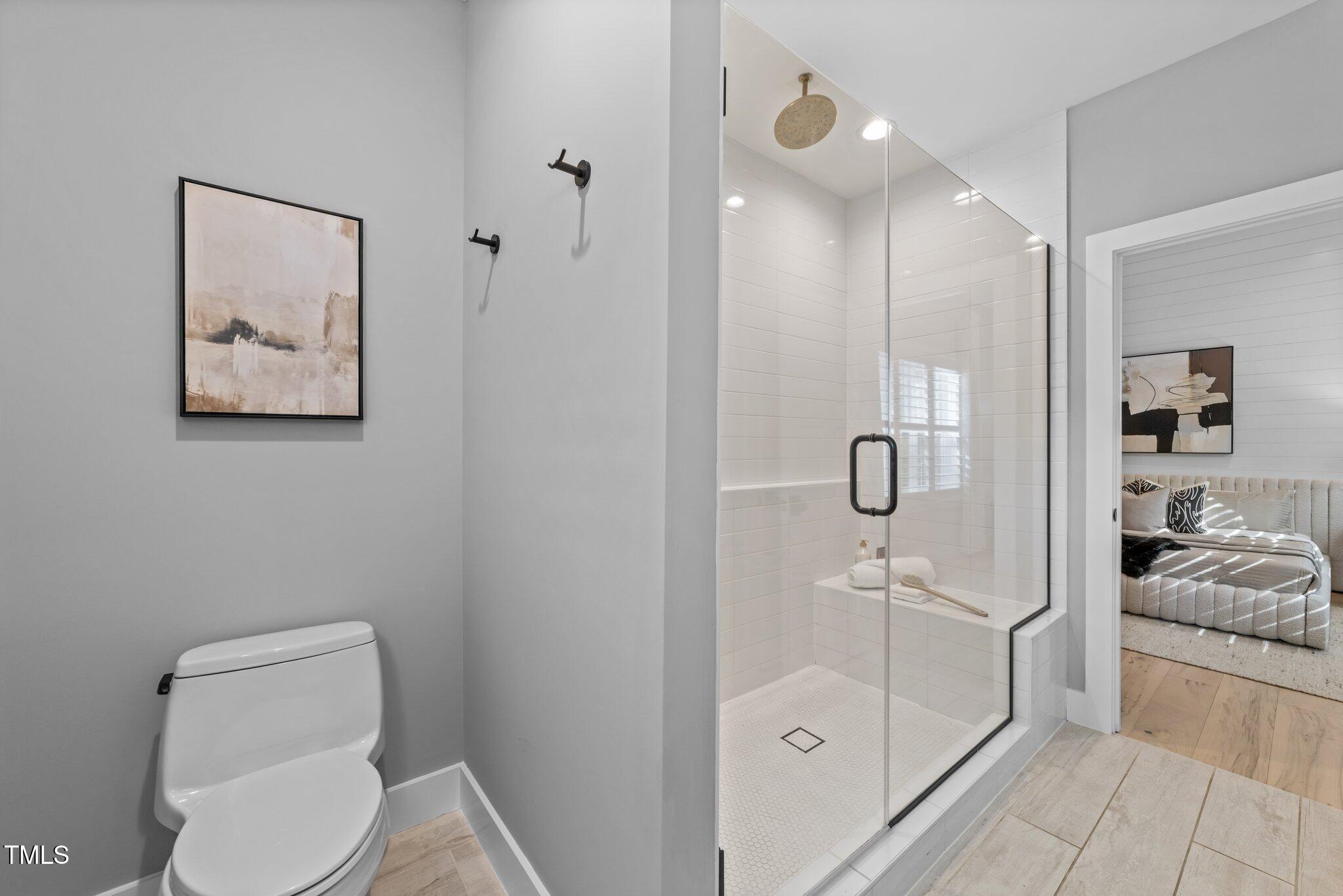 3316 Milton Road Raleigh, NC 27609 - Photo 28 of 50 a bathroom with a toilet sink and shower