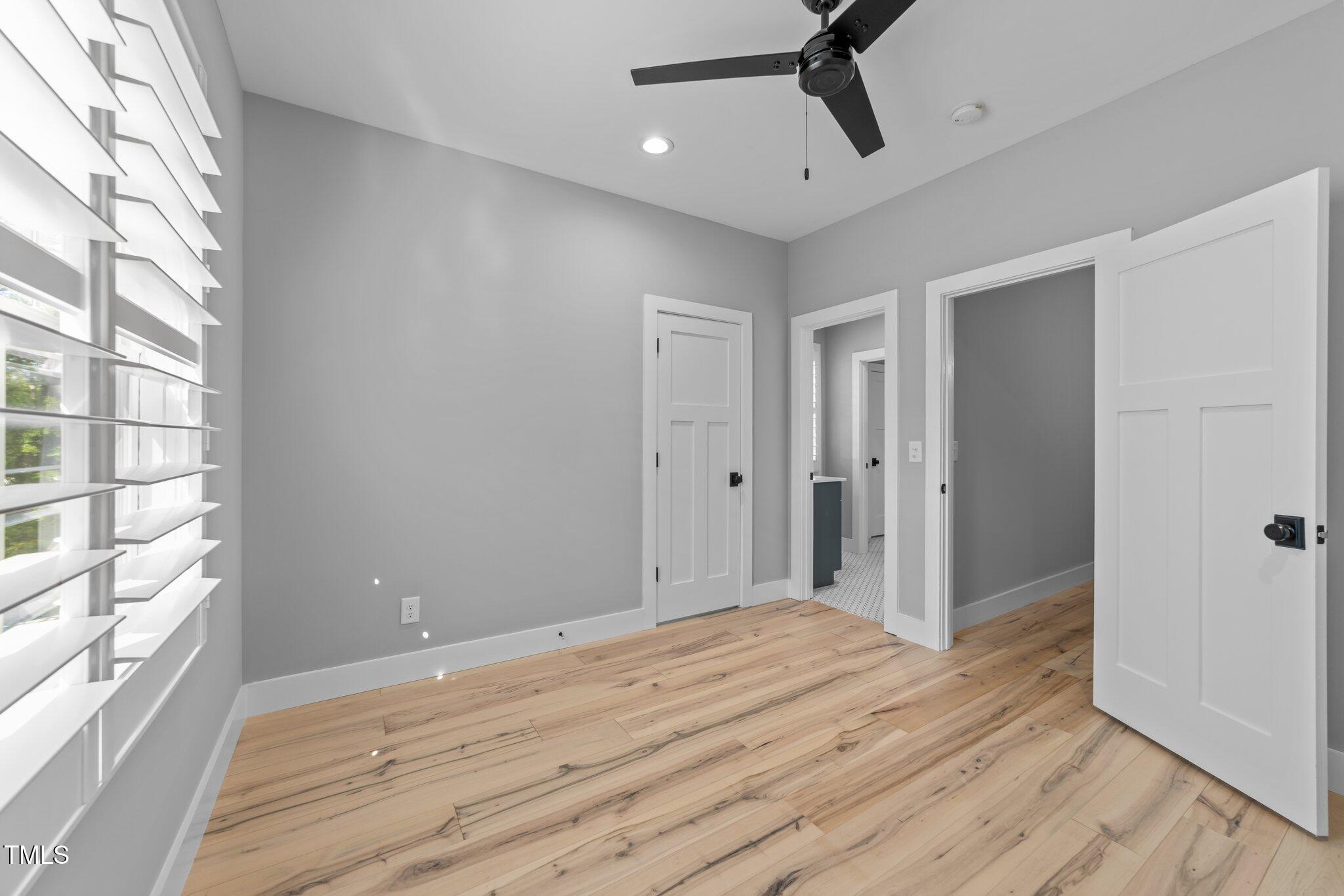 3316 Milton Road Raleigh, NC 27609 - Photo 30 of 50 a view of a room with wooden floor and windows