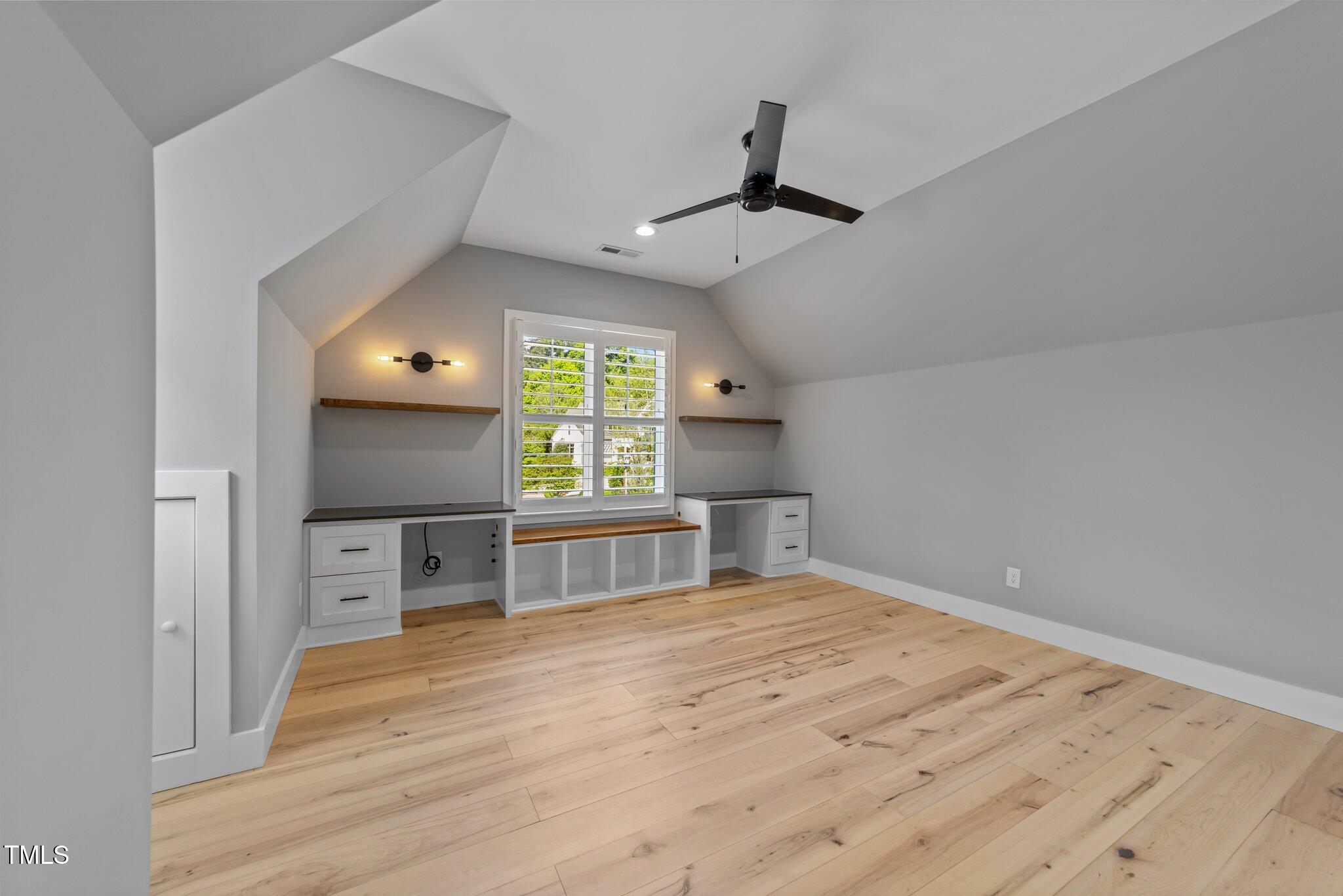 3316 Milton Road Raleigh, NC 27609 - Photo 34 of 50 a view of empty room with a window and wooden floor