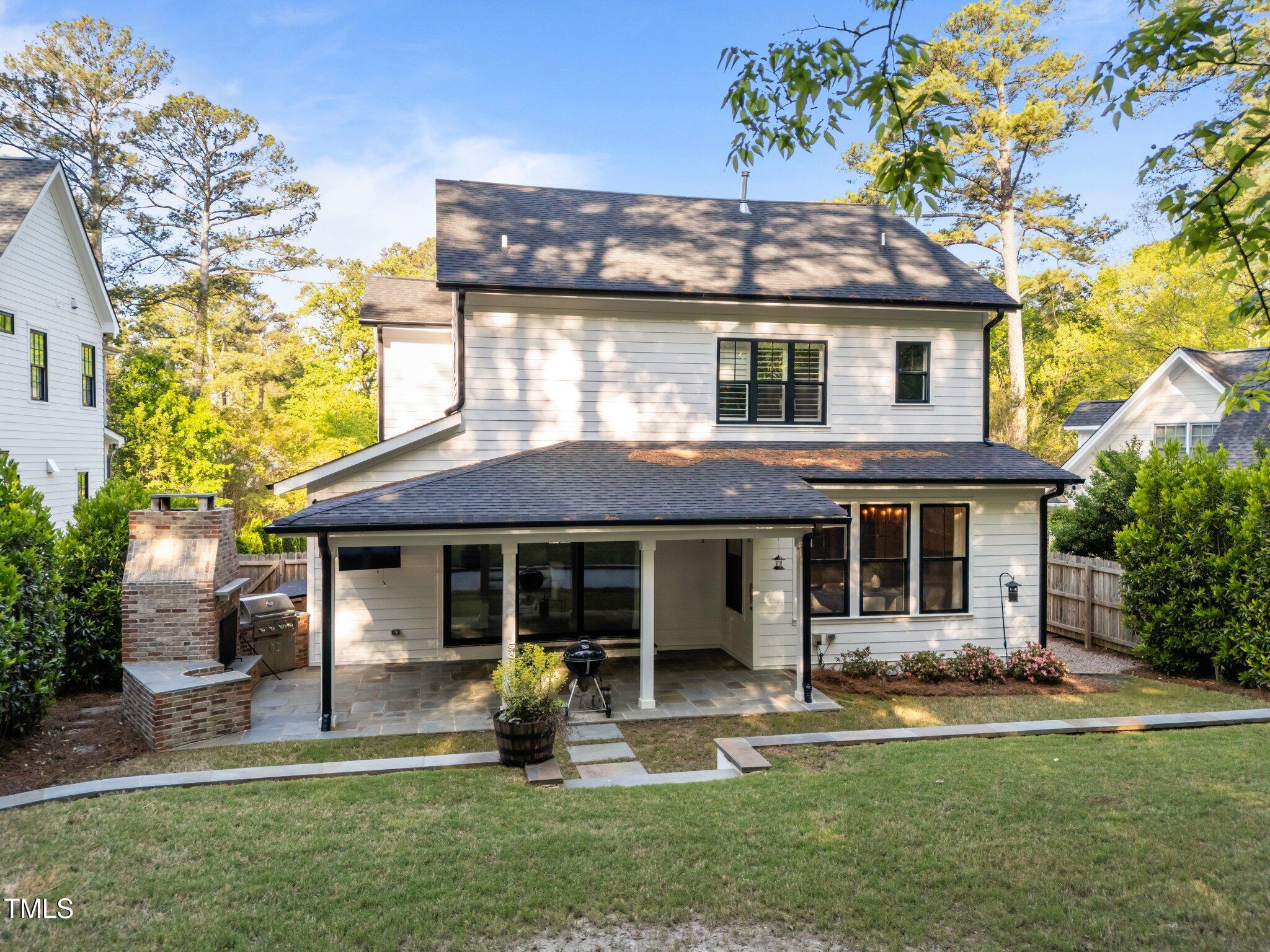 3316 Milton Road Raleigh, NC 27609 - Photo 41 of 50 a front view of a house with a garden and porch
