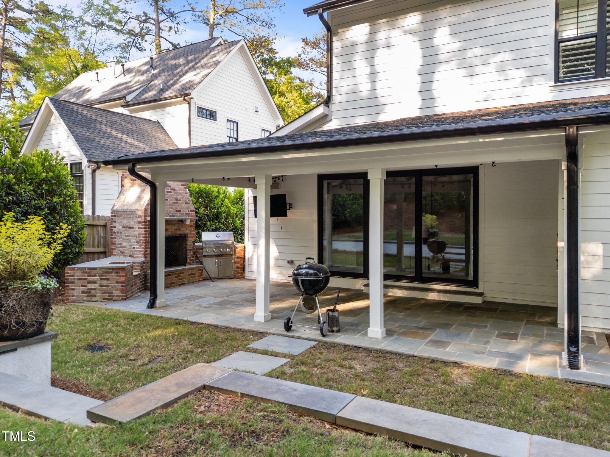 3316 Milton Road Raleigh, NC 27609 - Photo 42 of 50 a view of a dinning table and chairs in patio
